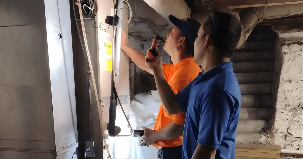 More Heat More Cool technician performing a full system inspection during a free estimate