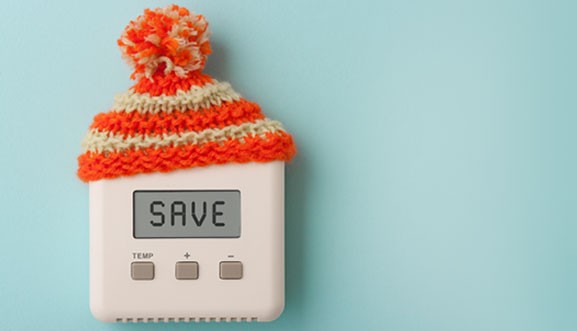 Ohio homeowner saving money on heating bills with energy-efficient HVAC tips