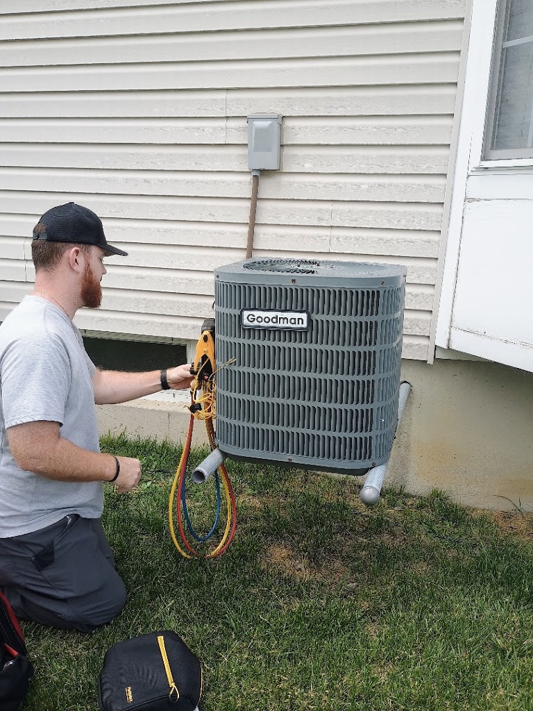 HVAC technician performing air conditioning service for Cincinnati and Dayton, Ohio homes