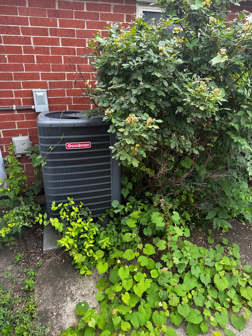 HVAC technician testing outdoor AC unit for repair in Cincinnati and Dayton, Ohio