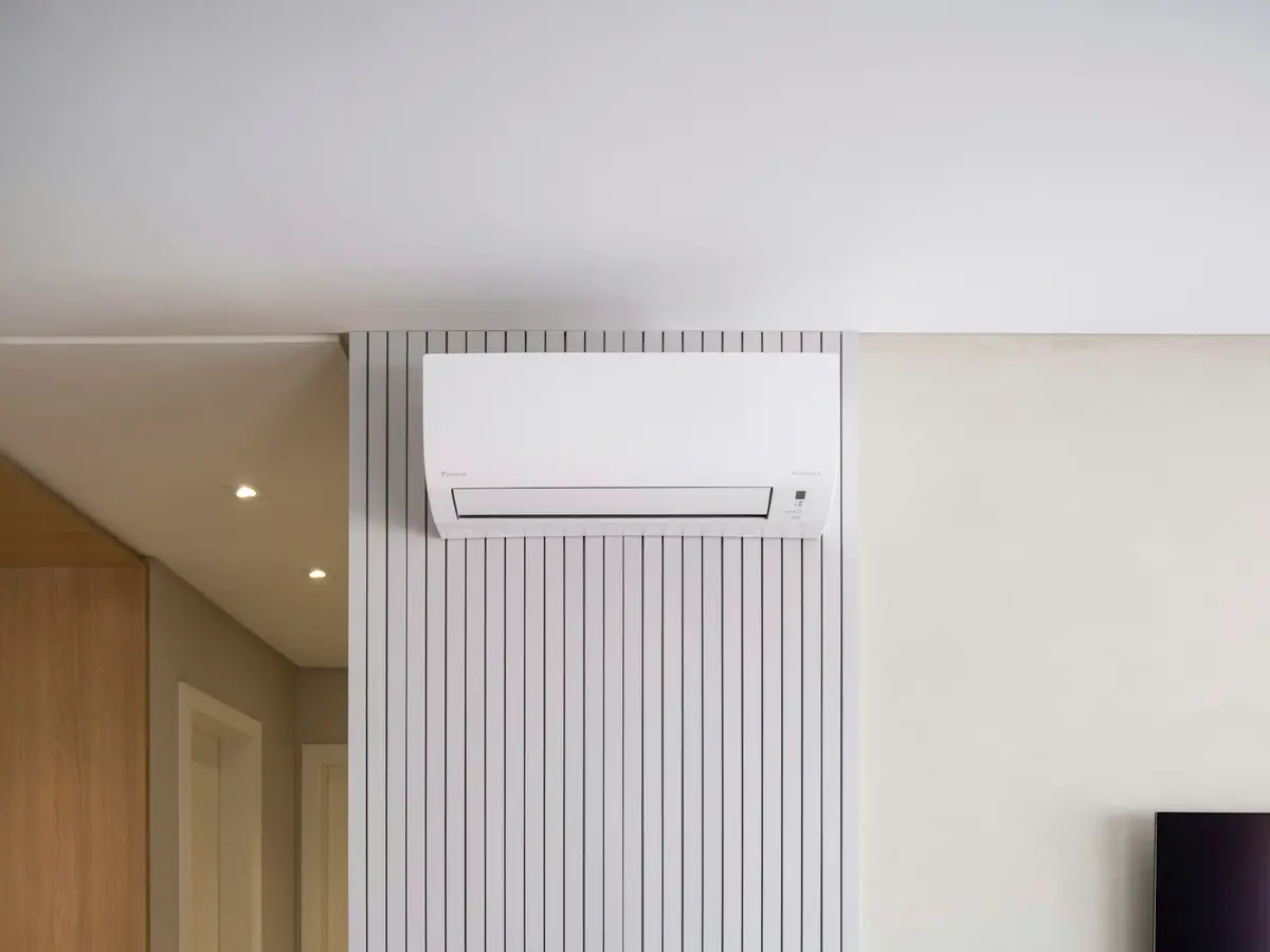 Wall-mounted ductless mini-split blending into a modern living room