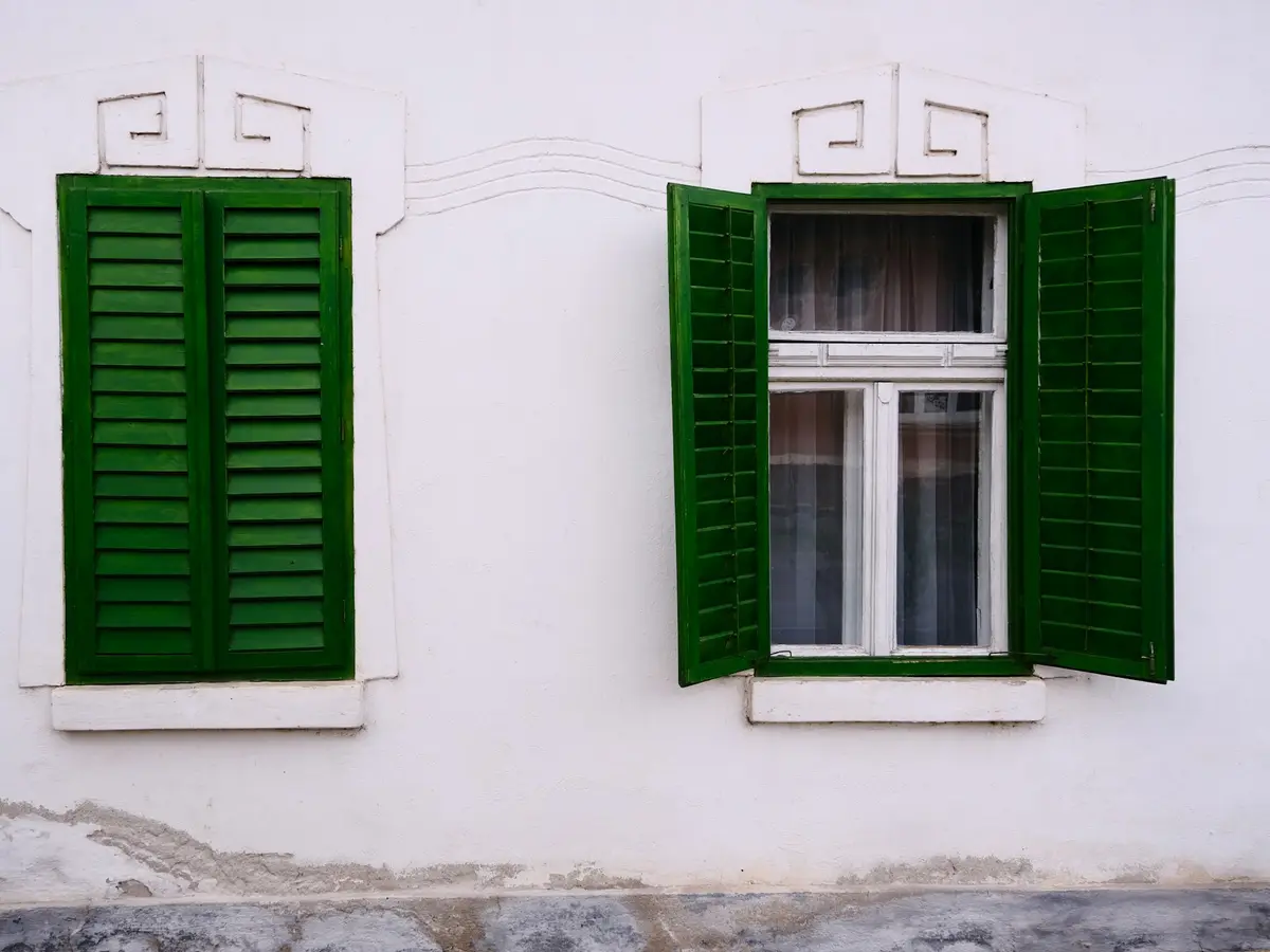 Well-kept older home with green shutters, a familiar sight in Franklin