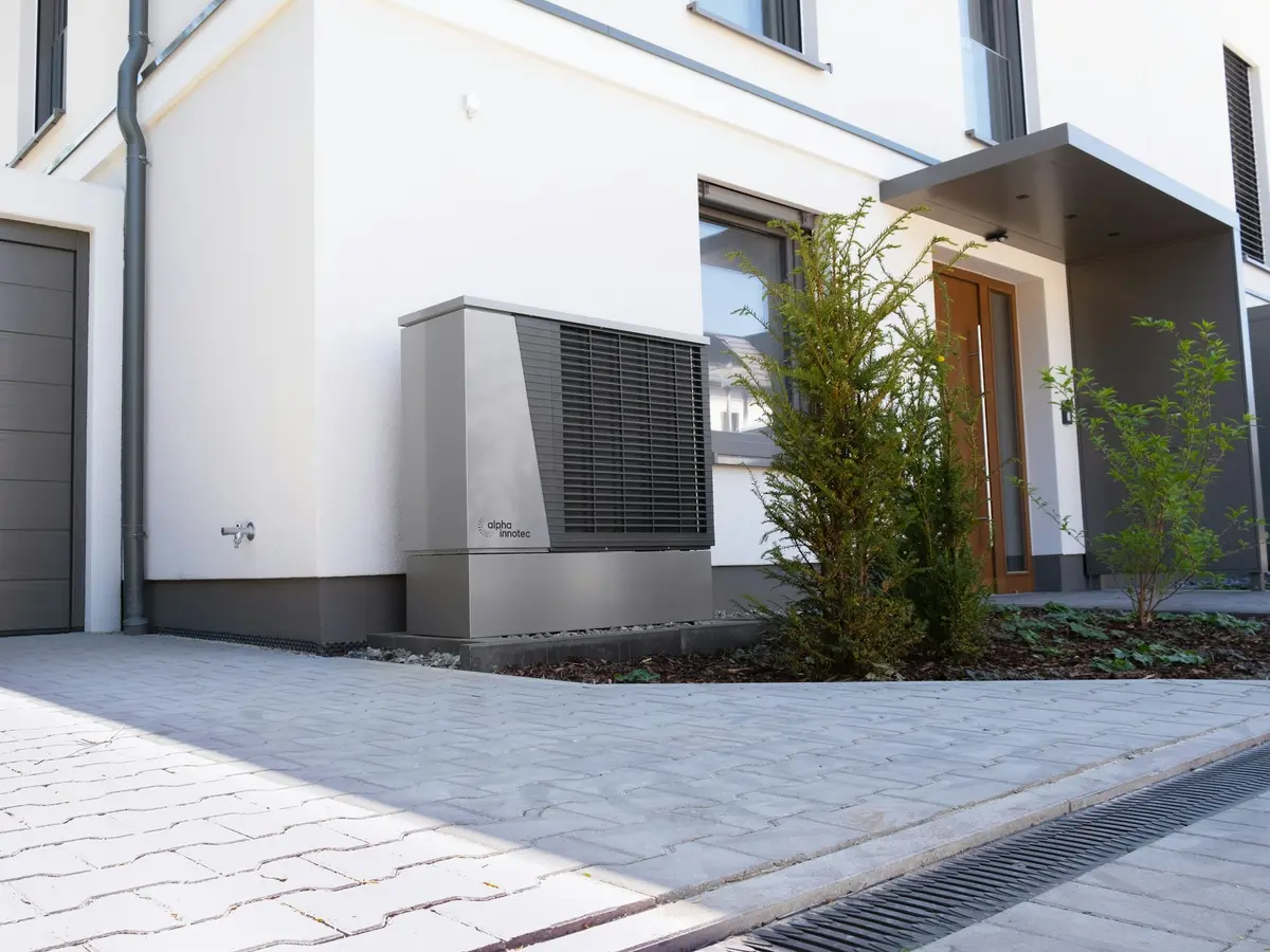 Modern heat pump unit installed at a contemporary home