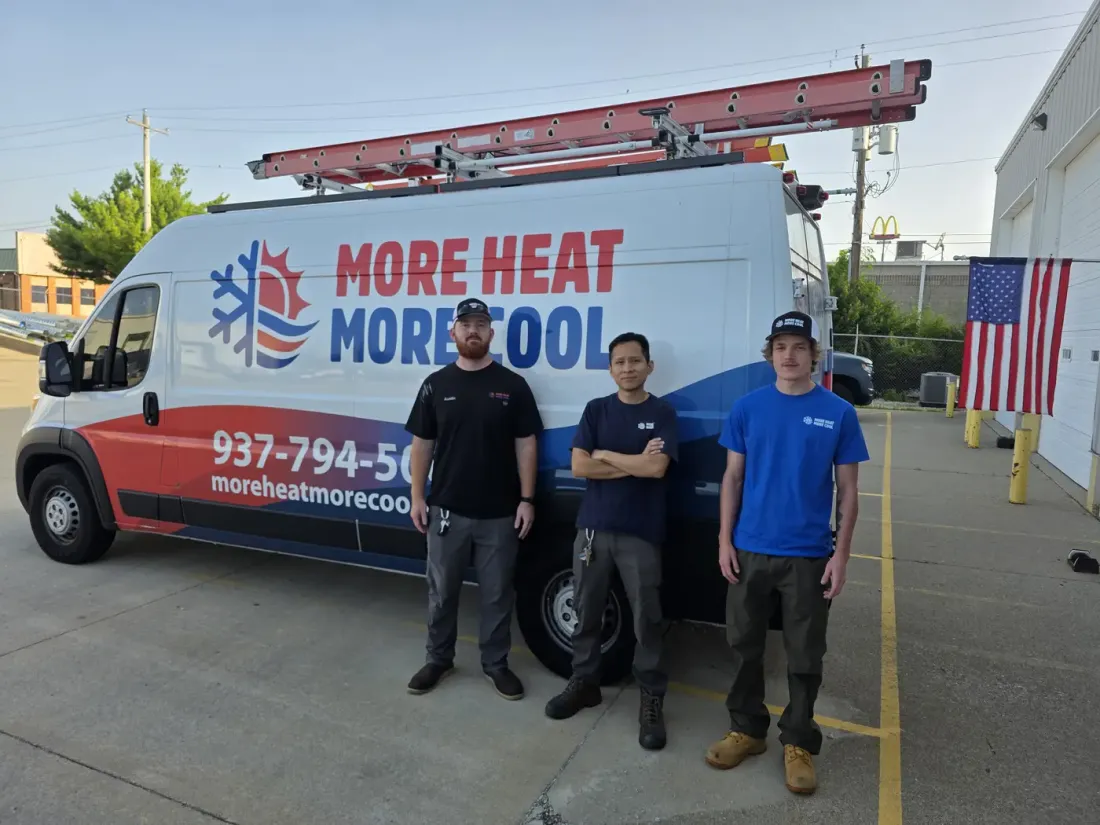The More Heat More Cool HVAC team in front of a branded company service van in Monroe, OH