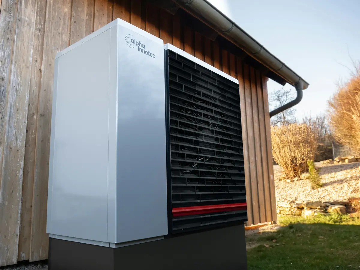 Newly installed high-efficiency air conditioner unit beside a modern home