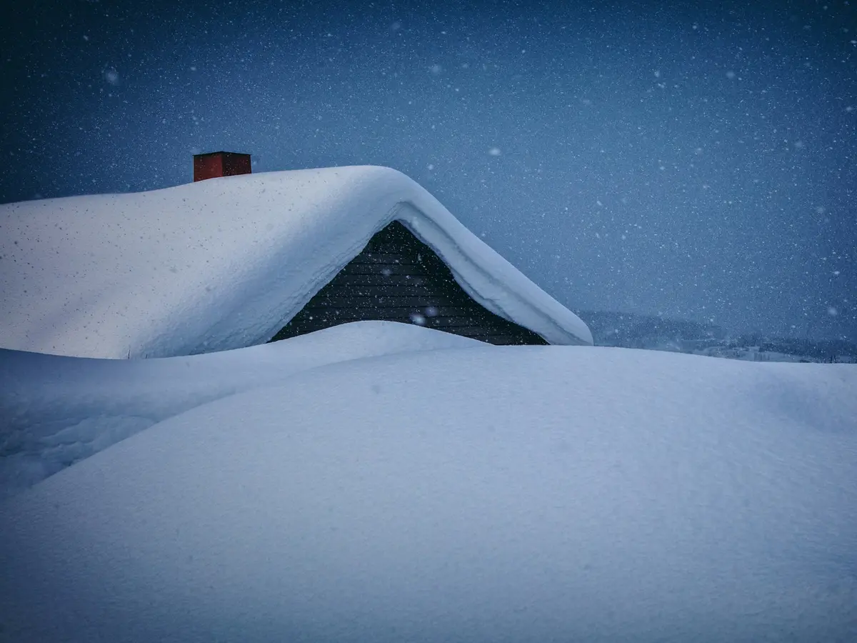 Snow-covered home in deep winter — when a working furnace matters most