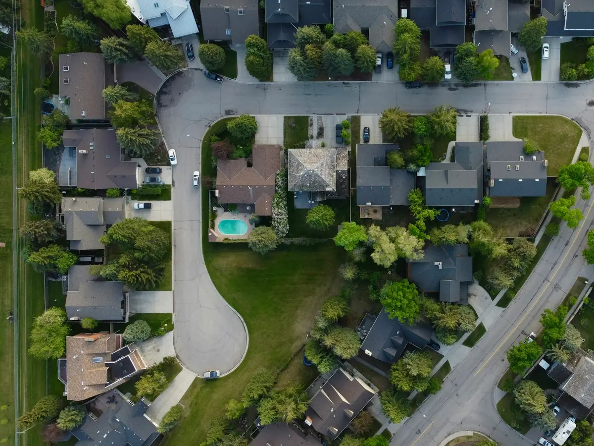Aerial view of a leafy suburban neighborhood like the Southwest Ohio communities More Heat More Cool serves