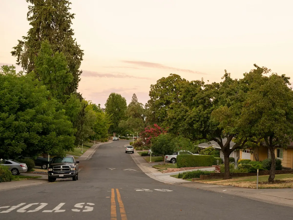 Evening settling over a suburban street like Washington Township’s